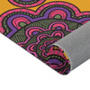 A close up photo of a rolled Area Rug with flower