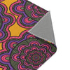 A close up photo of folded corner of Area Rug with flower pattern 