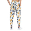  A man wearing a pair of pants with animal print back photo