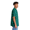A man wearing Black button Tropical Hawaiian Shirt with fish print side view