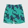 Blue green short swim trunks with whale print back view